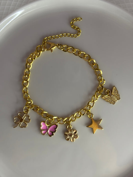 Gold charm bracelet with butterfly and star charms